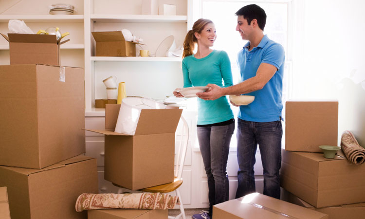 Couple unpacking boxes